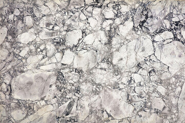 Swirling patterns of grey and white create a stunning marble background for design