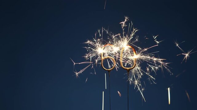 60 years anniversary celebration festive footage made with bengal fires in the form of number Sixty