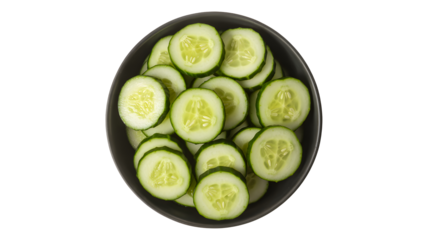 A dark bowl filled with freshly sliced green cucumber rounds arranged in a circular pattern isolated on transparent background
