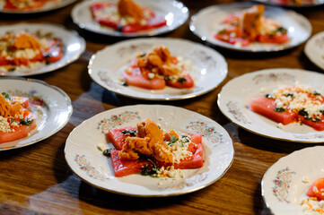 Summer watermelon salad with feta cheese, black olives and herbs