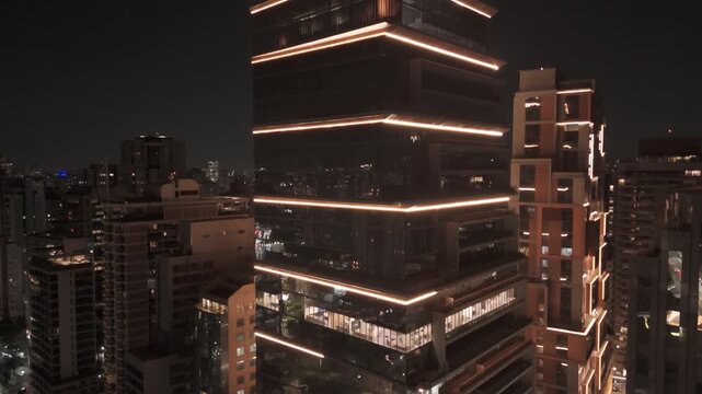 Dramatic Aerial Dolly-Out of an Illuminated Corporate Skyscraper at Night in Itaim Bibi, S&atilde;o Paulo