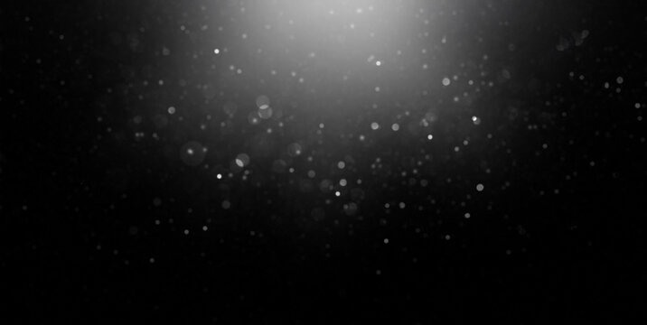 Dark dust particles floating in spotlight background