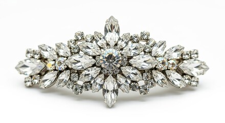 Vintage rhinestone brooch with ornate design on white background  