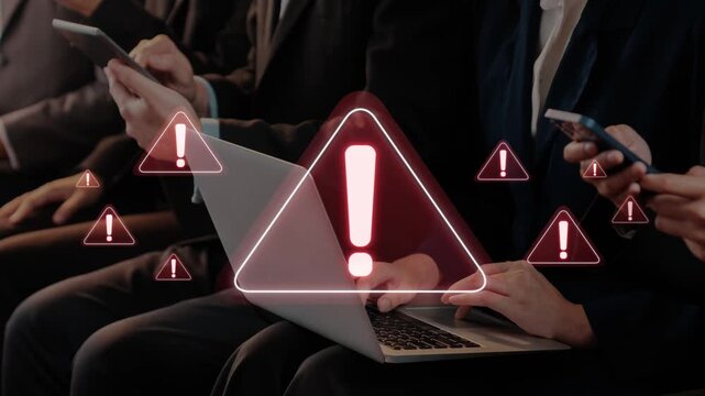 A group of business professionals in a meeting room interact with mobile devices and a laptop, with warning symbols highlighting the need for urgent attention. Raster