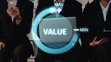 Professionals examine value indicators using laptops in a sleek office, highlighting collaboration and strategic decision-making in a business environment. Raster