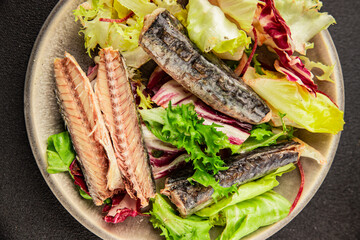 Mackerel salad canned fish, lettuce leaves tasty snack fresh delicious gourmet food table setting rustic food top view copy space keto and paleo diet vegetarian and vegan food pescetarian diet