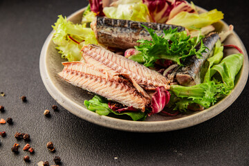 Mackerel salad canned fish, lettuce leaves tasty snack fresh delicious gourmet food table setting rustic food top view copy space keto and paleo diet vegetarian and vegan food pescetarian diet