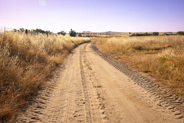 Camino Mozarabe de Santiago - dirt road on a summer landscape after Hinojosa del Duque, province of Cordoba, Andalusia, Spain