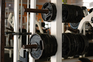 Weight plates stacked on a rack, symbolizing strength, fitness, and gym workout equipment for an active lifestyle