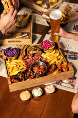 Large BBQ meat platter with fries and sides
Hearty grilled meat assortment served on a wooden board
Rustic BBQ feast featuring beef, chicken, and crispy fries