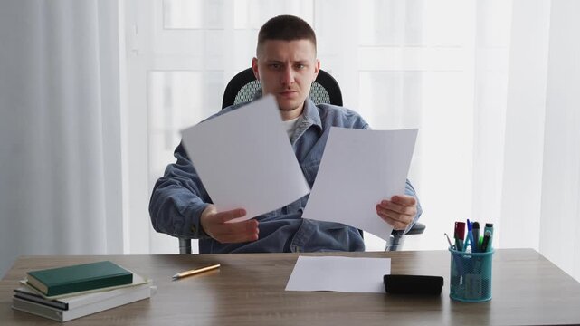 Journalism and paperwork.
A man works in an office and signs important documents.
An editor corrects text on a white sheet of paper.
Calligraphy and handwriting
