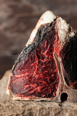 Raw dry aged T-bone steak as a premium beef cut
Dry aged porterhouse steak presented as high...