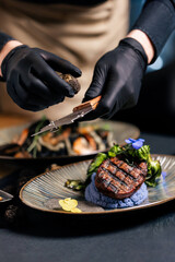 Gourmet grilled steak topped with shaved truffle
Premium beef medallion served with truffle garnish
Fine dining steak presented as a luxury truffle dish