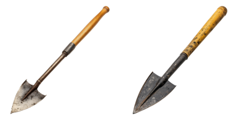 Two old gardening tools with wooden handles and metal blades are standing still, ready for planting. They appear to be vintage, showing signs of use and age.