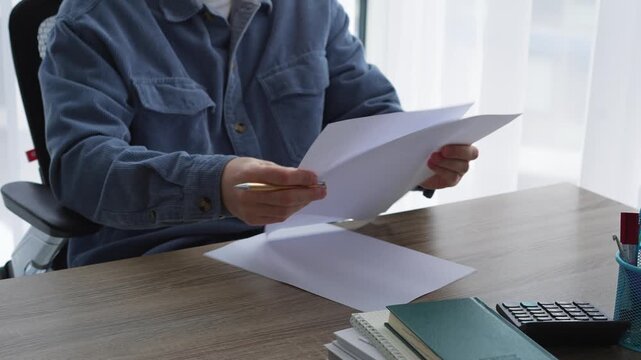 Writing at a desk in an office.
A businessman writes and signs a contract.
A journalist writes an article for publication in a magazine or news outlet.
Editor, writing, pen, screenwriter, news, readin