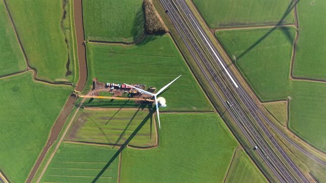Aerial View of Wind Turbine Construction with Crane