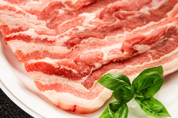 Bacon slice lard with meat slices pieces pork tenderloin portion size natural product tasty snack fresh delicious gourmet food background on the table rustic top view copy space