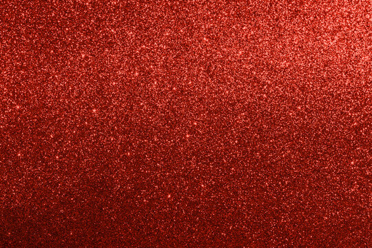 Red glitter background with sparkling shine for festive luxury design and glamorous projects