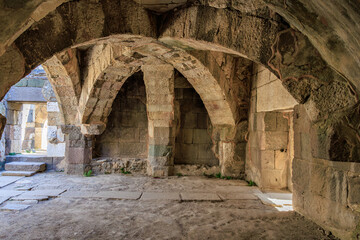 Ancient stone archways in historic ruins with natural light and shadow play. Authentic ancient Smyrna ruins in Izmir, Turkey