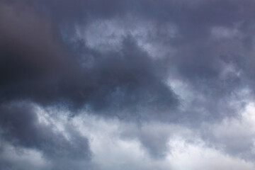 Dramatic dark stormy sky with heavy gray clouds