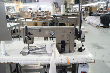 Sewing machine in production. Factory without people. Machines in production. Sewing workshop.