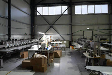 Factory. Production. Sewing factory without people. Sewing and embroidery machines, large machines.