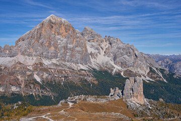 The Cinque Torri, a well-known geological formation in Dolomites with the Tofana di Rozes in the background, as seen from the hike to the refuge Nuvolau. Autumn landscape.