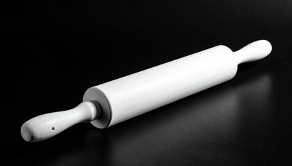 White rolling pin with tapered handles on dark surface