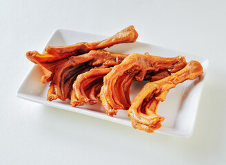 Tender braised duck feet, a culinary adventure ideal for Asian cuisine promotions and unique dining experiences.