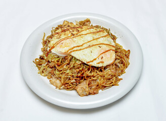 yakisoba, a delightful noodle dish topped with a perfectly fried egg. Ideal for food blogs, menus, or culinary projects.
