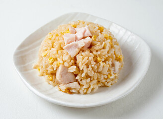 chicken fried rice, perfect for a quick lunch or a comforting dinner. Served hot and fresh on a white plate.