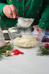 Step-by-step preparation of Candy Cane shortbread cookies in Christmas decor on a light concrete background. Merry Christmas! Traditional Christmas treats
