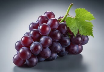 Fototapeta premium A lush bunch of ripe red grapes with a fresh green leaf showcasing natural beauty and healthy sweetness on a subtle background