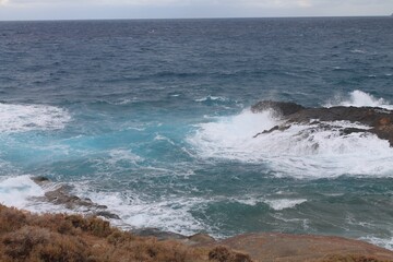 waves crashing on rocks