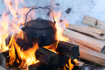 Sooty teapot on fire