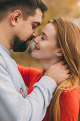 intimate autumn portrait, emotional scene showing closeness and gentle expressions in autumn tones