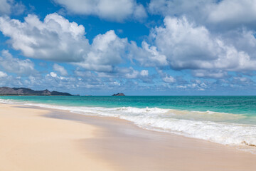 Waimānalo Beach Park, Honolulu, Windward Coast Oahu, Hawaii. Pacific Ocean. Cumulus clouds are clouds that have flat bases and are often described as puffy, cotton-like, or fluffy in appearance. 