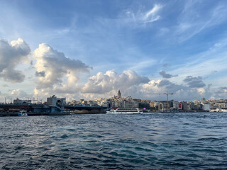 Naklejka premium Karakoy Coastline, Galata Bridge and behind Galata Tower from Eminonu Port in Istanbul, Turkey.