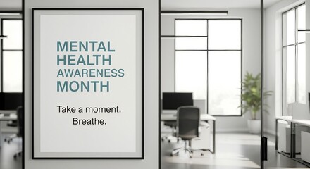 Mental Health Awareness Month poster hanging in a modern office. Workplace wellness and mindfulness concept for employee well-being and stress management.
