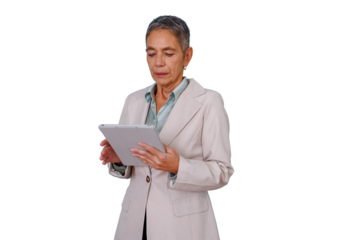 Senior businesswoman using a digital tablet, embodying experience and modern technology in a corporate setting. Transparent background