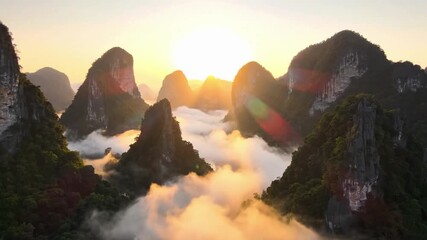 Majestic sunrise over misty mountains