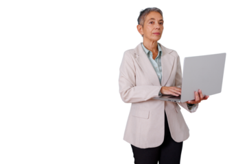Senior businesswoman standing, working on laptop, confident and focused, managing online tasks with transparent background