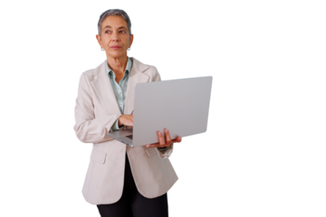 Senior business woman using laptop, thinking, working with technology, managing and leading a successful career