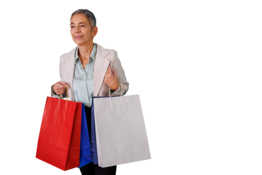 Senior woman smiling, carrying shopping bags, symbolizing successful retail therapy. Transparent background