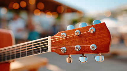 Close-up of guitar headstock in outdoor setting