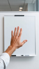 Hand on blank paper with pen