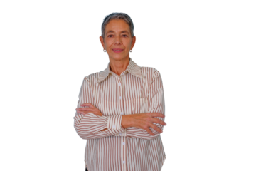 Senior woman smiling, standing with arms crossed, portraying confidence and business casual style, transparent background