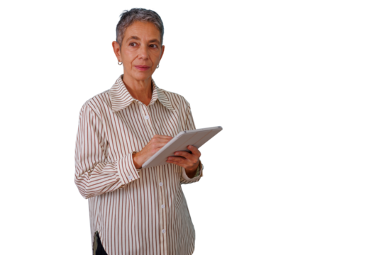 Mature woman standing, using a digital tablet for business tasks, working with technology, transparent background