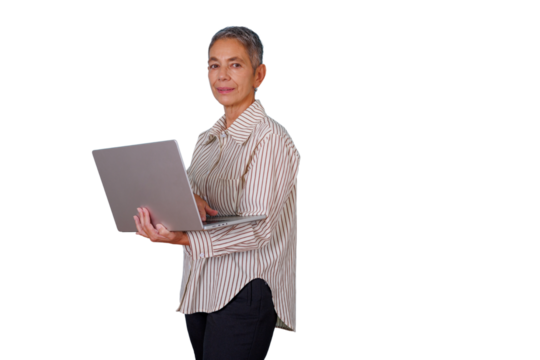 Confident senior businesswoman using a laptop for productivity, standing with a determined expression on transparent background