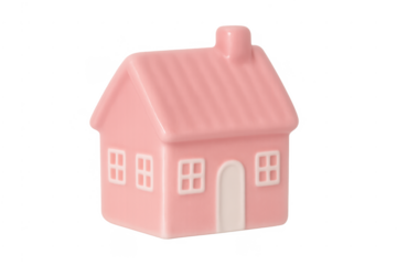 Pink ceramic mini house creating concept of property market, housing, and family